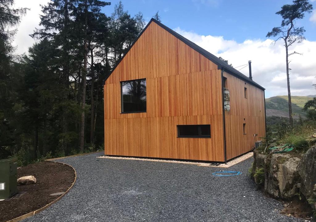Crianlarich Ski Chalet | An Caisteal Lodge with cascading waterfall view