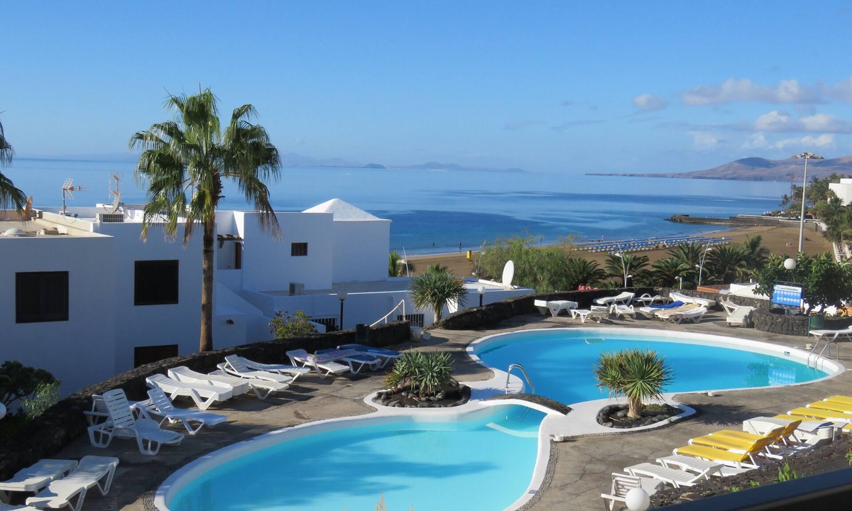Puerto del Carmen Apartment | Front line, contemporary, stunning sea views, pool, WiFi, SKY