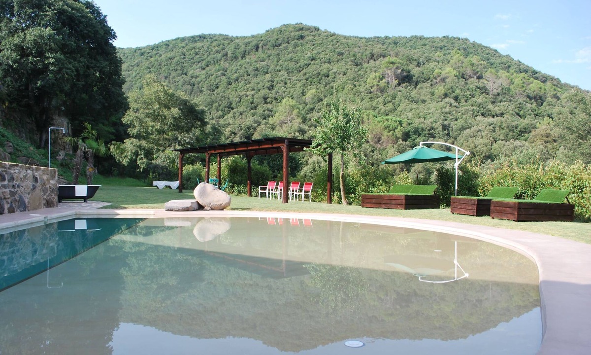 Santa Pau House | LUXURY SUITES MANOR. Swimming pool. BBQ. Waterfall. Volcanoes. Up to 14 people