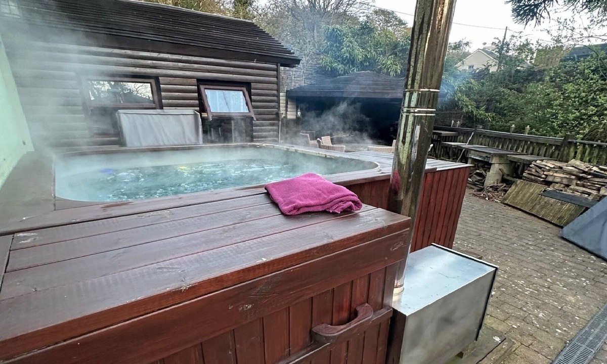Foxdale House | The hot tub by the waterfall - facilities included