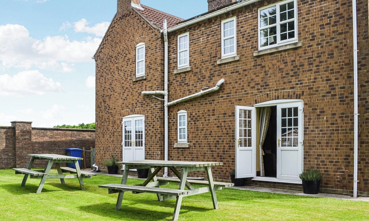 Leven Cottage | You are sure to love the hot tub and four poster beds.
