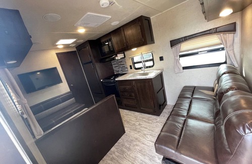 Norval House | 2019 East to West Della Terra 25 Foot Travel Trailer on a rural property