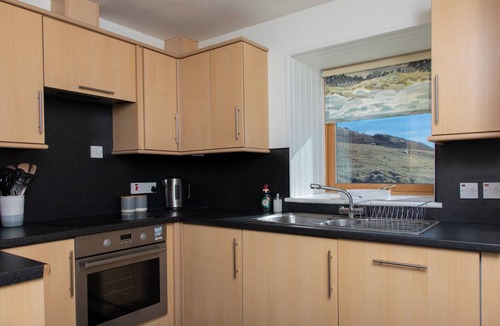 Kingsburgh Cottage | A secluded Skye boathouse where rugged beauty meets refined coastal living.