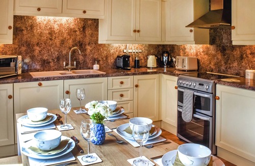 Hopton Cottage | A superb family lodge with a private hot tub, sauna and games zone.