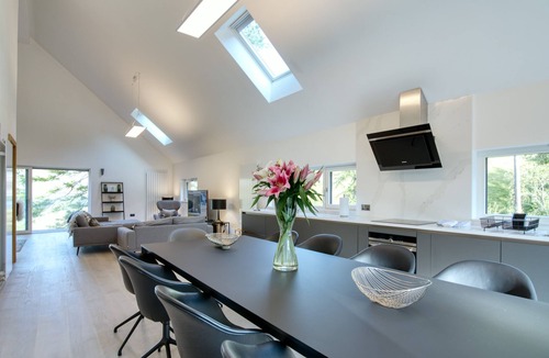 Crianlarich House | An Caisteal chalet sleeps up to 8 guests in 4 bedrooms with loch, mountain and waterfall view.