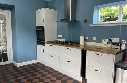 Wigtown Cottage | Apple cottage: A cosy cottage with log burners and mature garden. Pet-friendly.