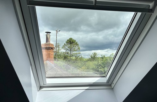 Wigtown Cottage | Apple cottage: A cosy cottage with log burners and mature garden. Pet-friendly.