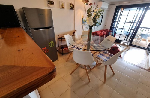 Pedrinya Apartment | Bright apartment with communal pool, 50m from the beach