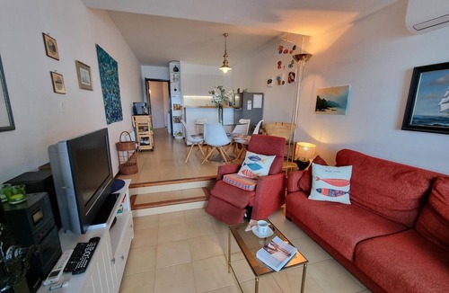 Pedrinya Apartment | Bright apartment with communal pool, 50m from the beach