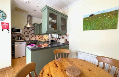 Taynuilt Cottage | Clematis is a spacious, 2-person cottage with lovely outside sitting area.