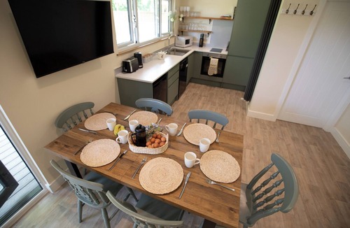 Toppesfield Cabin | Countryside lodge with hot tub, sauna sessions, fire pit & space to gather for families & friends.