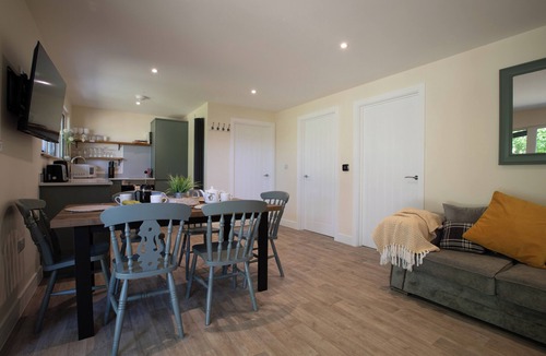 Toppesfield Cabin | Countryside lodge with hot tub, sauna sessions, fire pit & space to gather for families & friends.