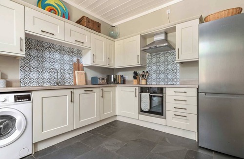 Milford Haven Cottage | Courtyard Cottage with Private Patio & Hot Tub