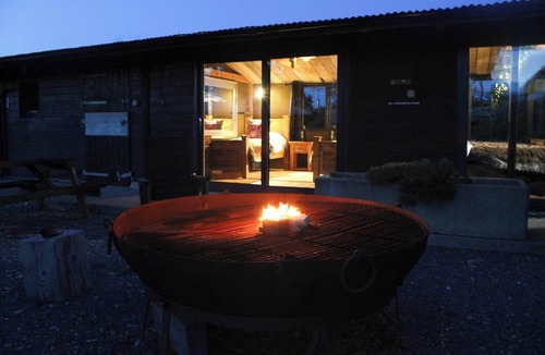 Glentham Cabin | Drumcoltran Cabin - Puppy Lounge, arcades, games room
