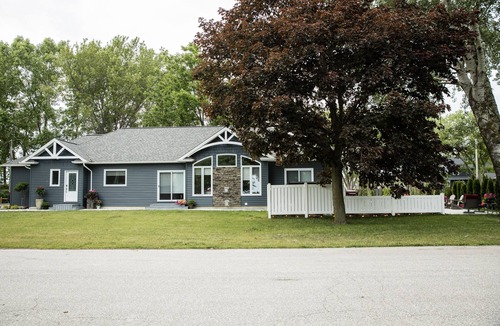 Town of Essex House | Elegant Three Bedroom Home with lake view and a hot tub
