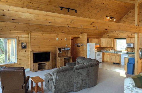 Eagle River Cabin | Lake front timber cottage amongst towering pines. Family and pet friendly