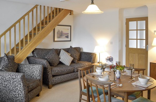 Woodhorn Cottage | Lovely property with an open staircase leading to 2 bedrooms and a bathroom.