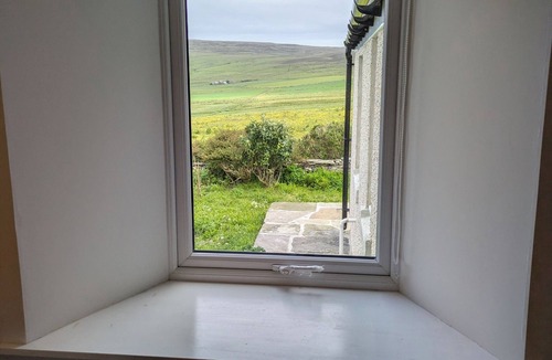 Rousay Cottage | LOWER COTTAGE, pet friendly, with a garden in Rousay, Orkney Islands