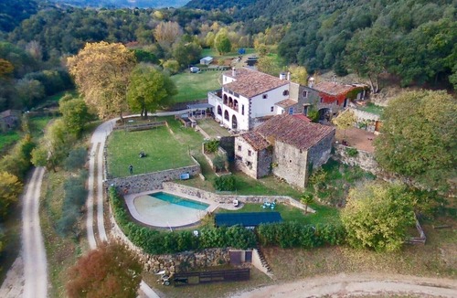 Santa Pau House | LUXURY SUITES MANOR. Swimming pool. BBQ. Waterfall. Volcanoes. Up to 14 people