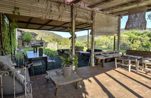 Santa Pau House | LUXURY SUITES MANOR. Swimming pool. BBQ. Waterfall. Volcanoes. Up to 14 people