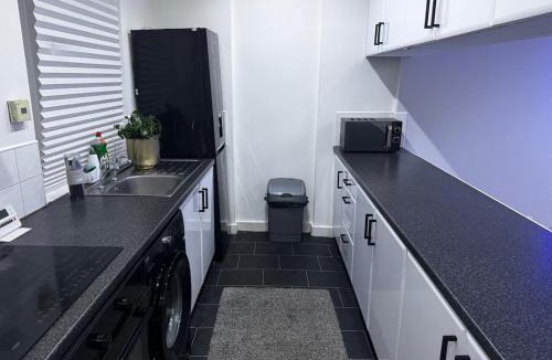Cumbernauld Apartment | Modern 3-Bedroom Home with Cozy Cinema-Style Living Space