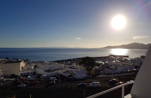 Puerto del Carmen Apartment | Modern apartment ,stunning sea and mountain views in the old town. WiFi and pool