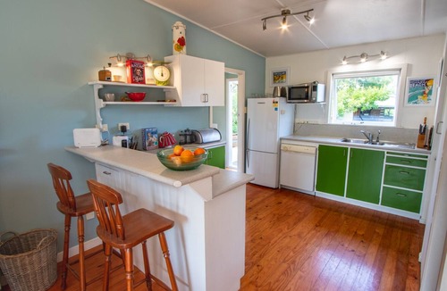 Pohara House | Poharadise - classic family bach near the beach, pet friendly