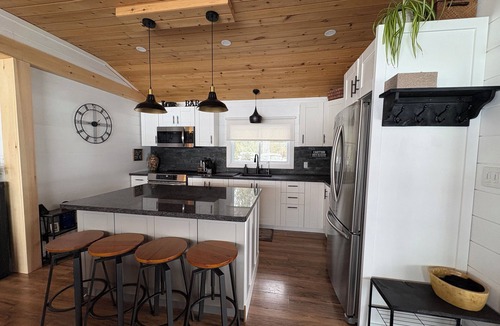 Trent Lakes Cottage | Private Waterfront Point |Surrounded by Water, Fire Pit & Kayaks Included