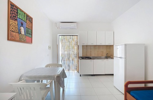 Chiesiola Resort | Property in a Holiday Village 'Baia Falcone - Standard 301' with Sea View and Air Conditioning