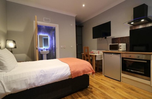Airdrie Apartment | Signature - Linden Cottage Room 2