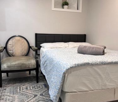 Milton Apartment | Studio Basement Suite with Double Bed and kitchen, Entrance from Garage