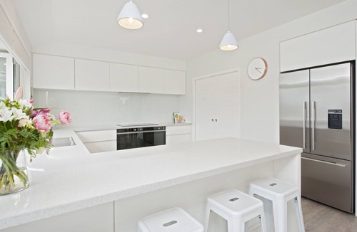 Richmond House | Sunny & spacious modern home with heated swimming pool.