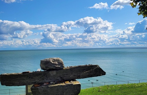 Romney Cottage | SUNRISE BAY has a panoramic view of Lake Erie with a private beach.