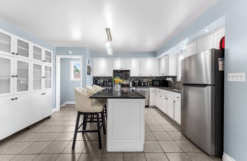 Riverside House | TOP Rated Home: Cozy & Spacious Family Home w/Fireplace, Sunroom and Heated Pool