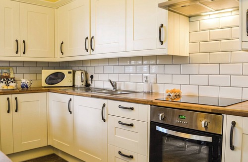 Leven Cottage | You are sure to love the hot tub and four poster beds.