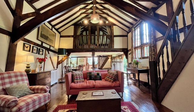 A unique Suffolk timber-framed cottage set within private lawns and woodland.