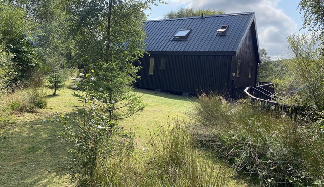 Beautiful cabin with log burner, wood fired hot tub and stunning views.