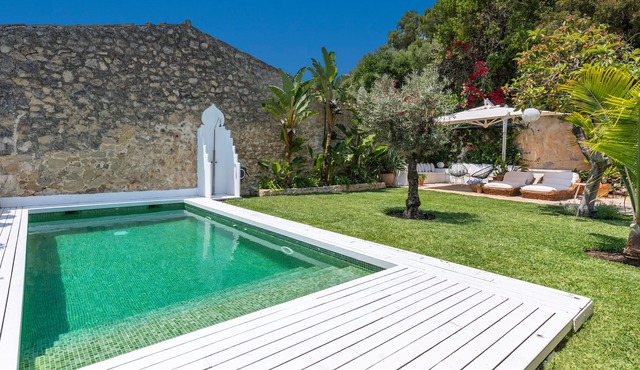 Luxury townhouse with garden and heated pool.