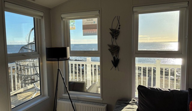New south facing lodge, amazing sea views, town amenities and beaches nearby.