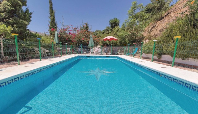Surrounded by trees in a very private environment is this typical Andalusian house, renovated in the