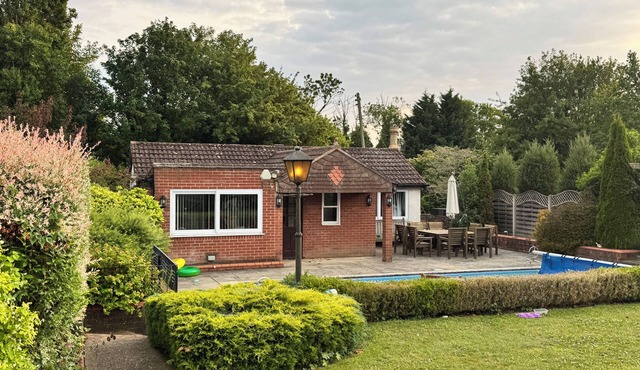 The Pool House. Set in idyllic country gardens with swimming pool.